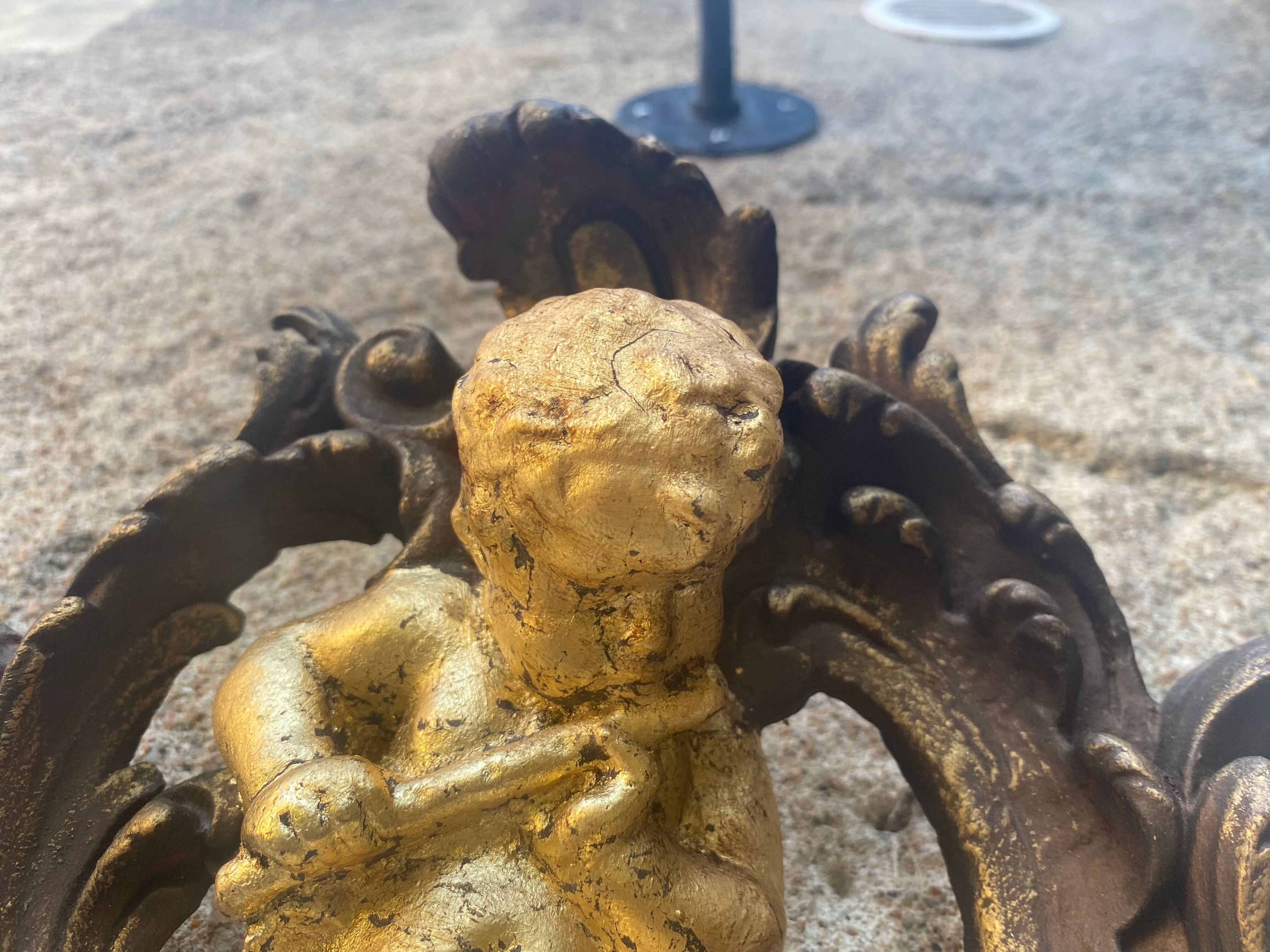 Pediment cherub musician