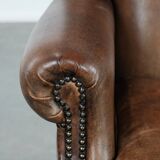 Warm, cosy and comfortable vintage sheepskin ear armchair with character