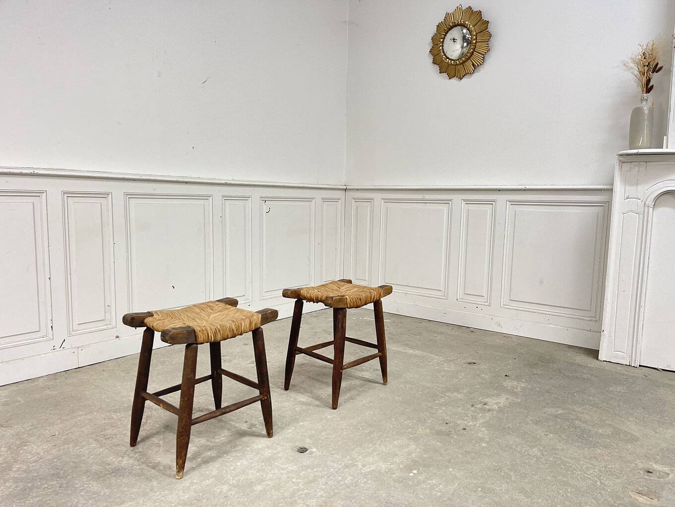 A pair of 1950s straw stools.