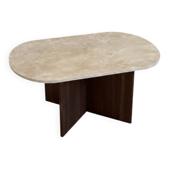Oval coffee table in travertine and dark oak.