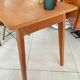 Old wooden desk or side table with compass legs