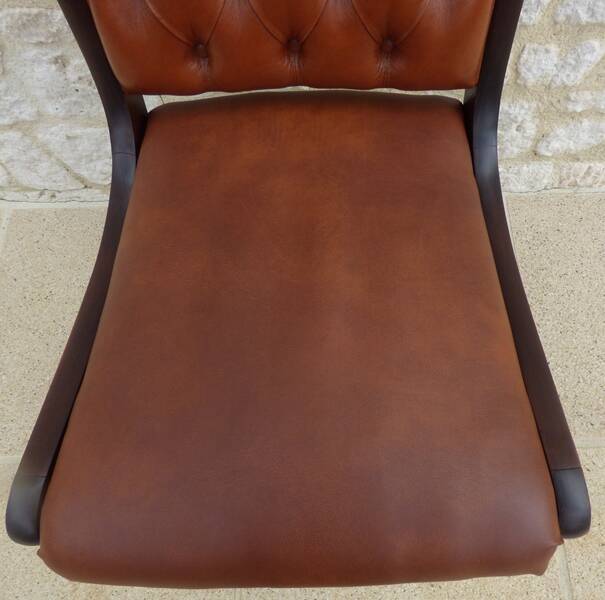 Chic Vintage Chesterfield style chair with wooden frame and faux leather
