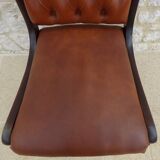 Chic Vintage Chesterfield style chair with wooden frame and faux leather