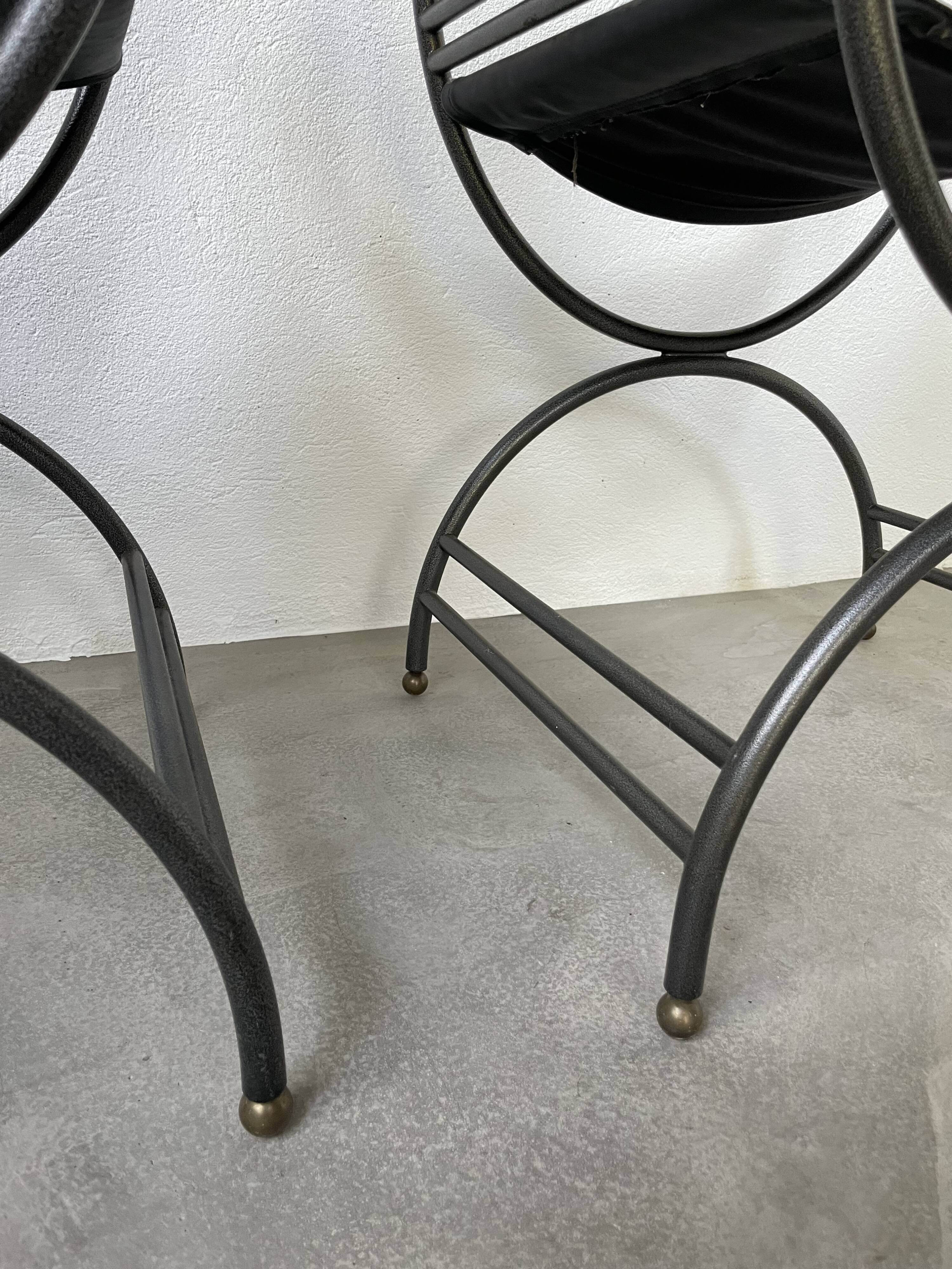 Pair of leather “curule” emperor armchairs