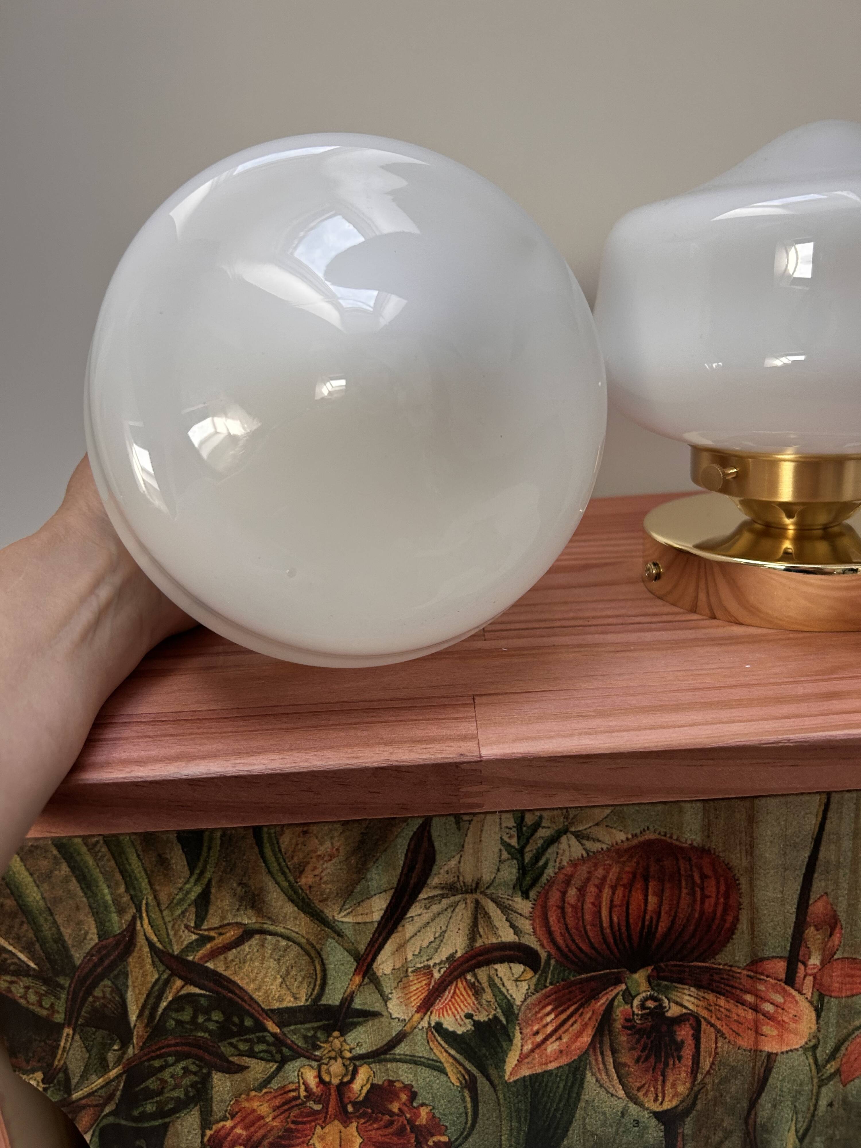 Pair of white opaline globe wall lights