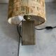 Small modernist table lamp with hand-woven shade.