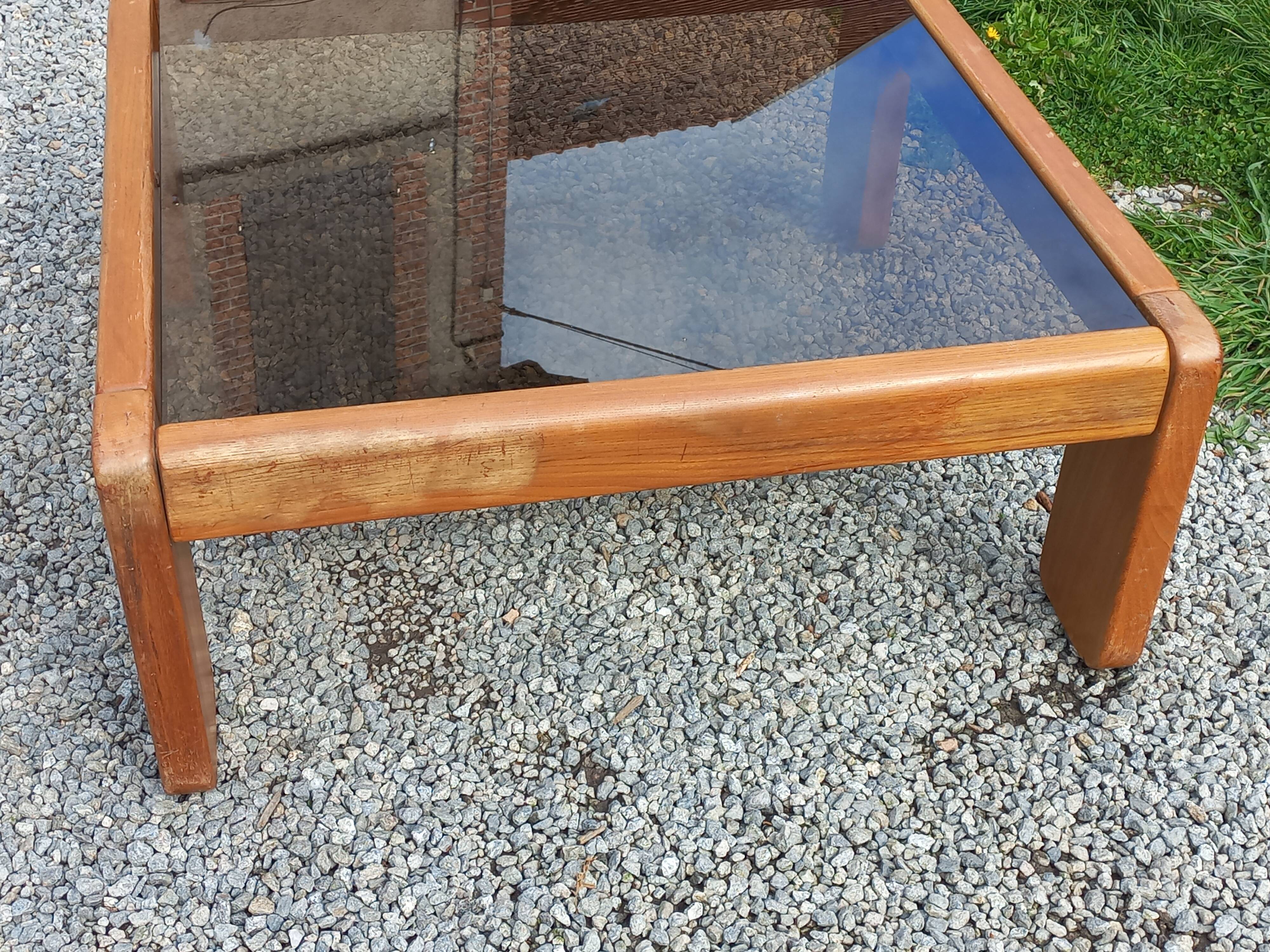 Coffee table from Regain in solid elm with a smoked glass top.