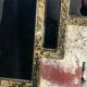 Art deco style "miami" mirror in patinated gilded wood 80x52cm