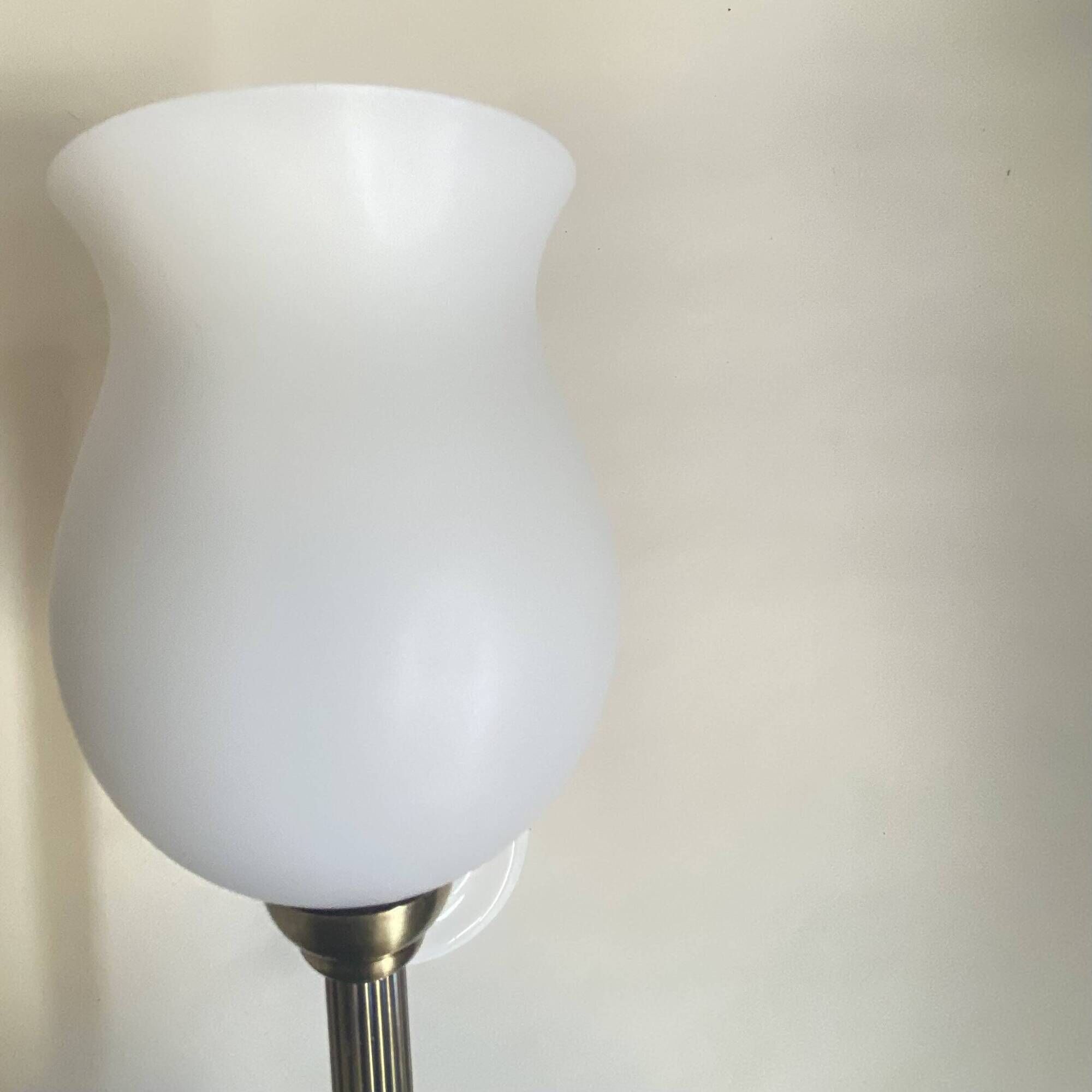Pair of brass torch wall lights with white opal glass and porcelain