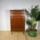 Mid-century Danish high chest of drawers with eight teak drawers.