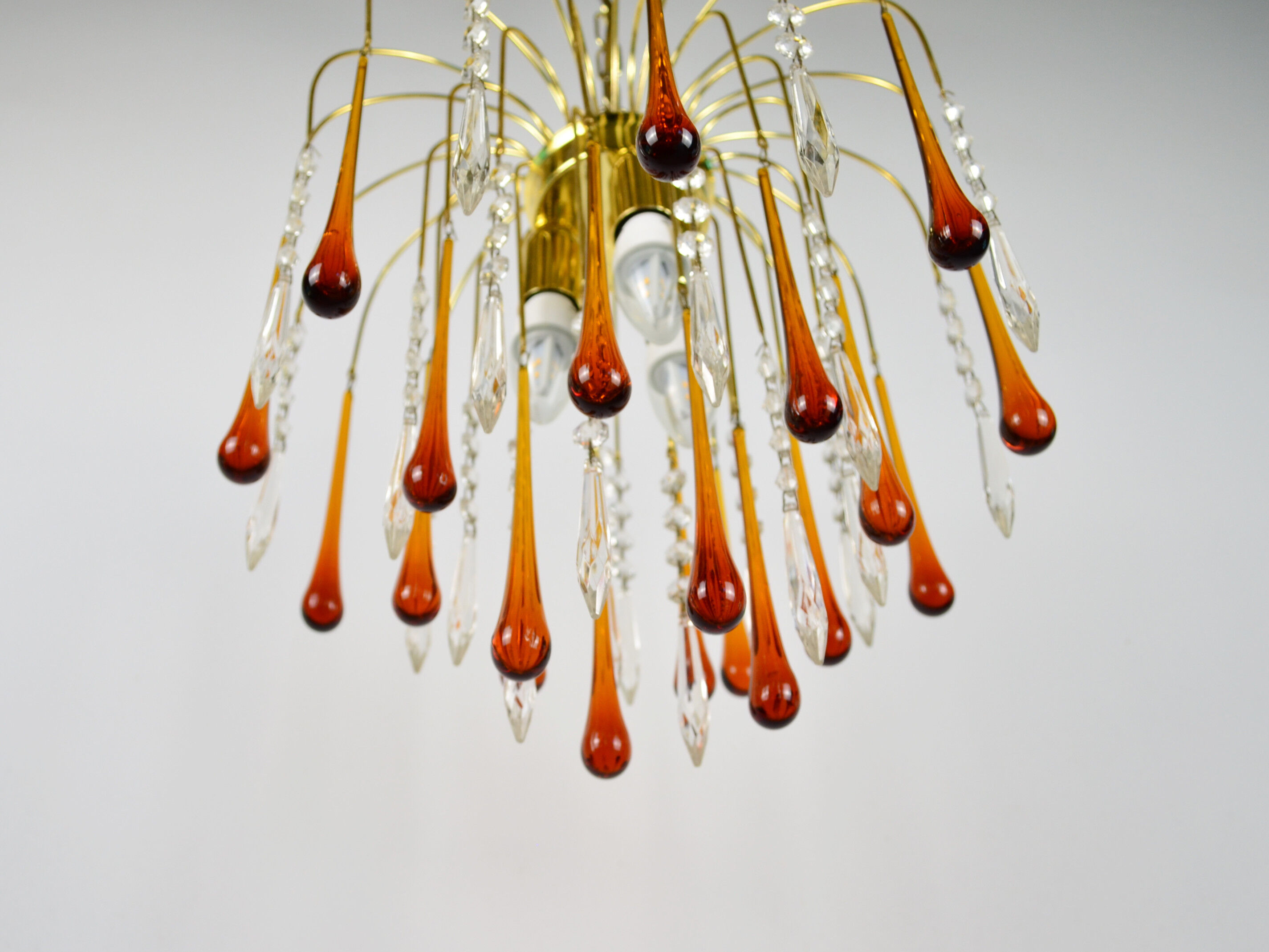 A pair of Mid Century 70's waterfall chandeliers. Murano glass amber drops. Paolo Venini style.