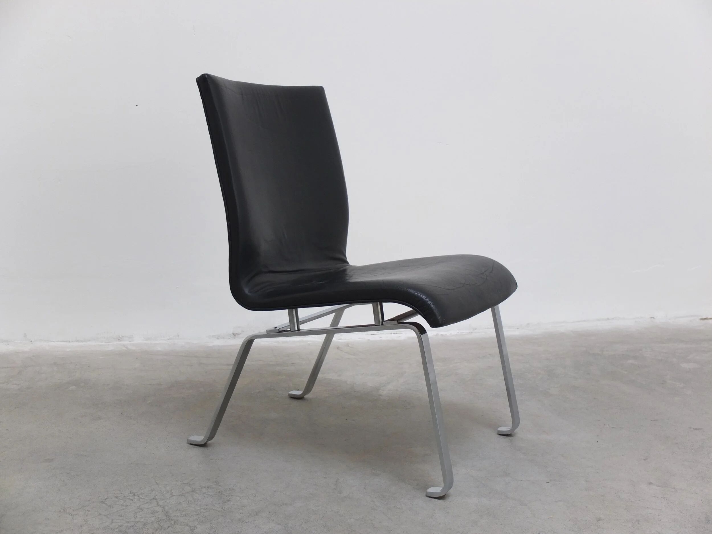 Unique black leather & steel modernist lounge chair, 1960s
