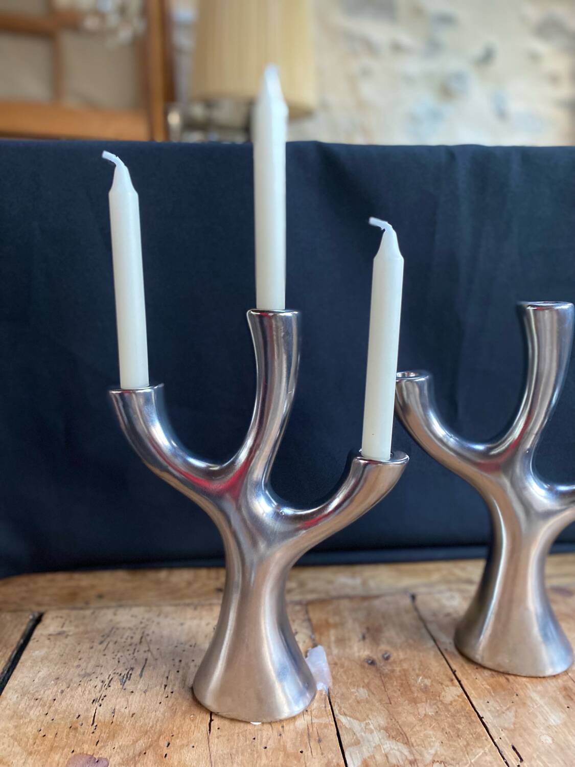 Silver candlesticks in the shape of a 3-branch tree