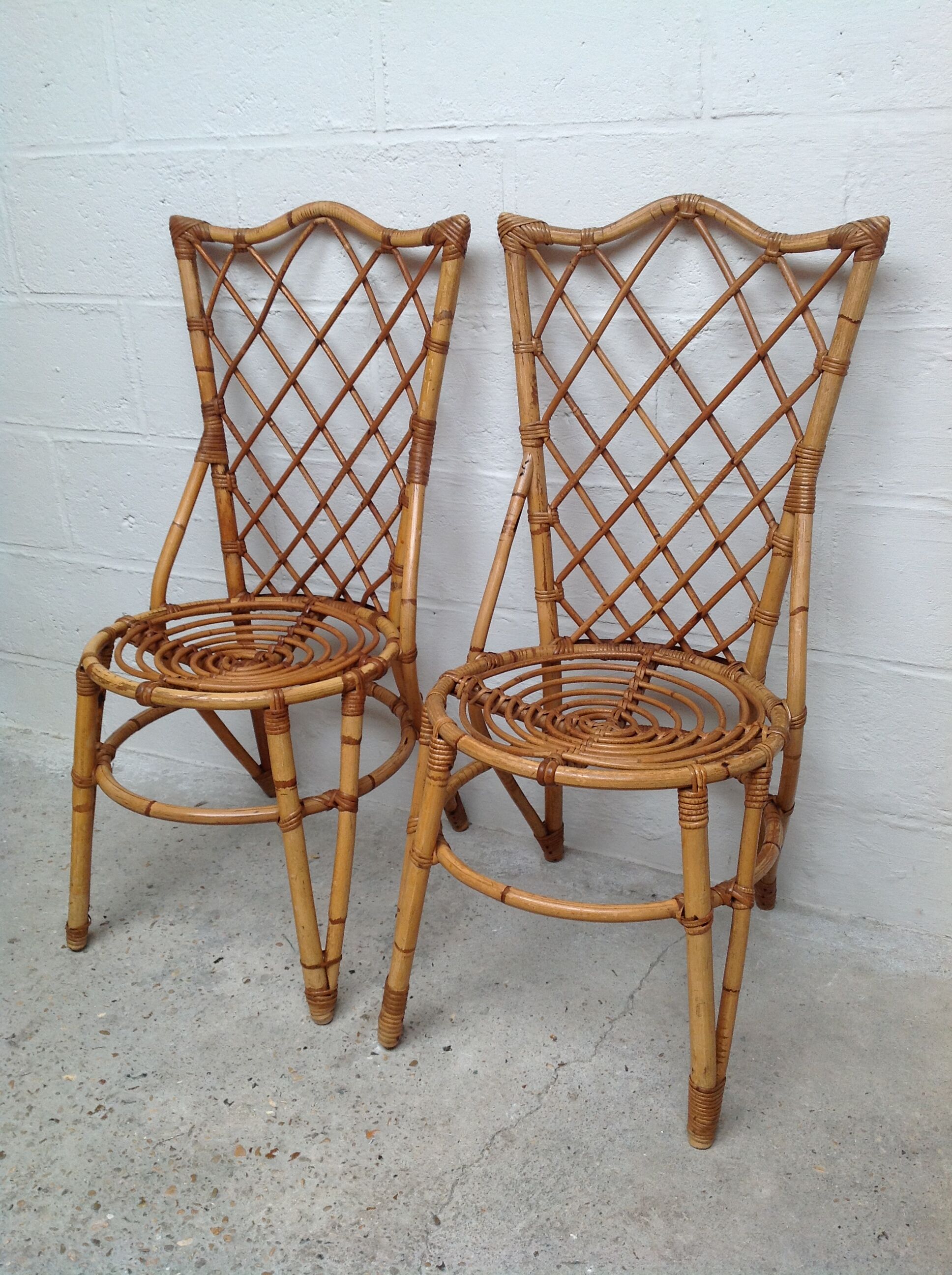 Pair of rattan chairs by Louis Sognot