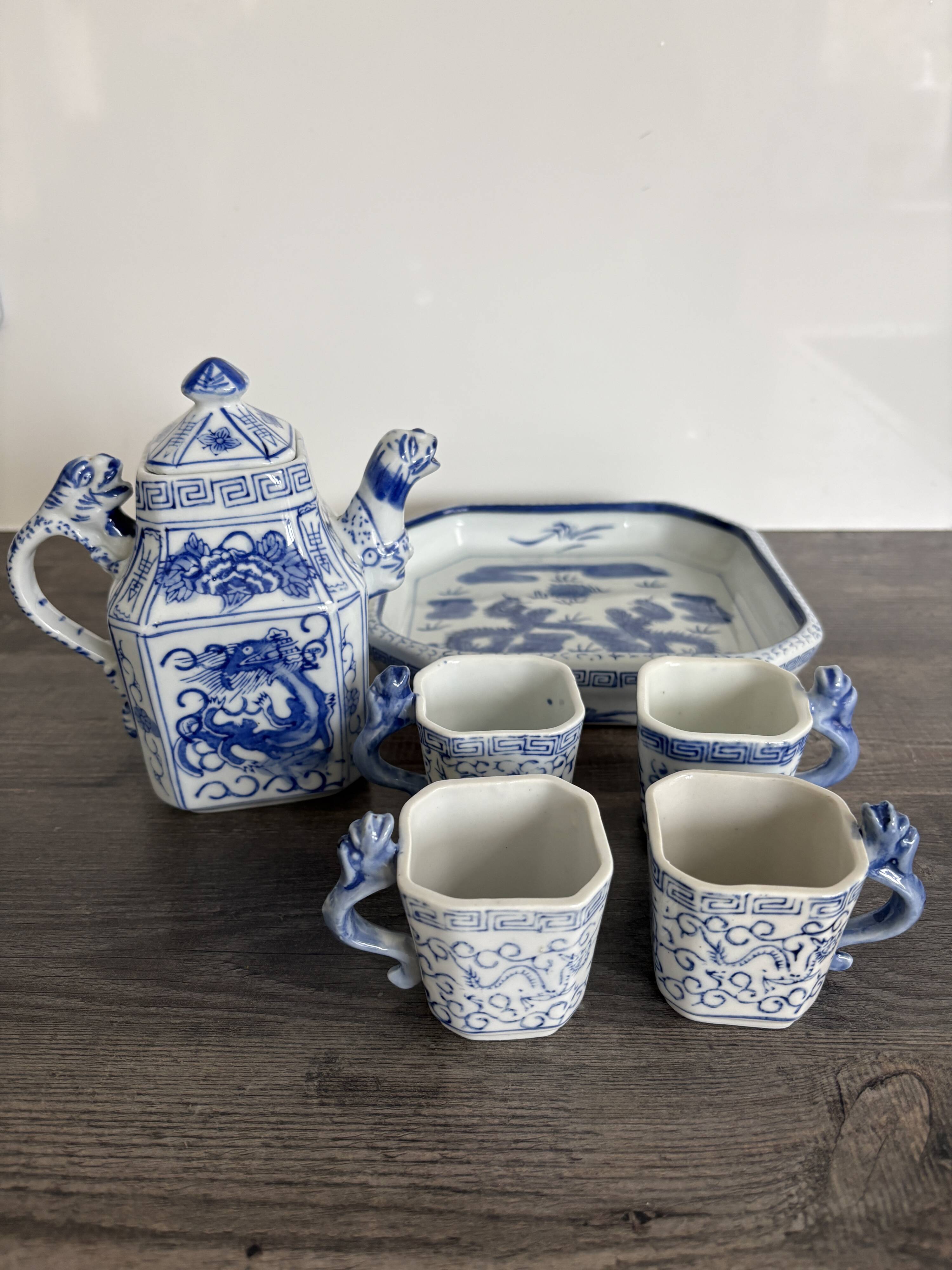 Antique Chinese tea set decorated with dragons.