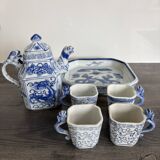 Antique Chinese tea set decorated with dragons.