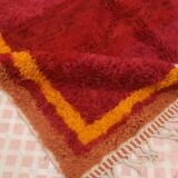 Minimalist burgundy cherry red shaggy berber rug
