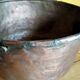 large copper and bronze cauldron
