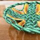 Woven green fruit bowl from the 1950s.