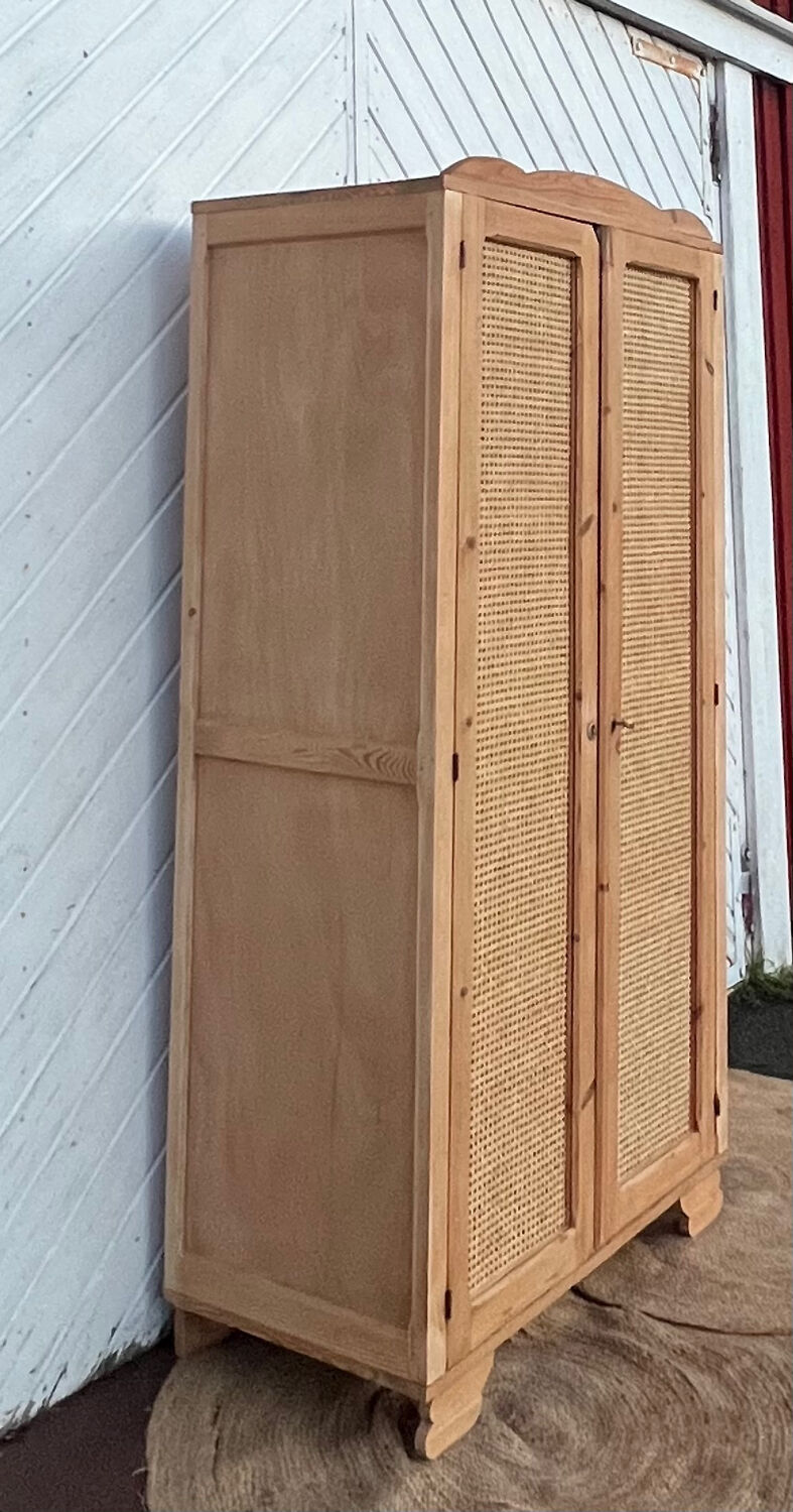 Renovated antique wardrobe in raw wood and caning.
