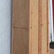 Renovated antique wardrobe in raw wood and caning.