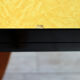 Table formica jaune et pieds bois années 50