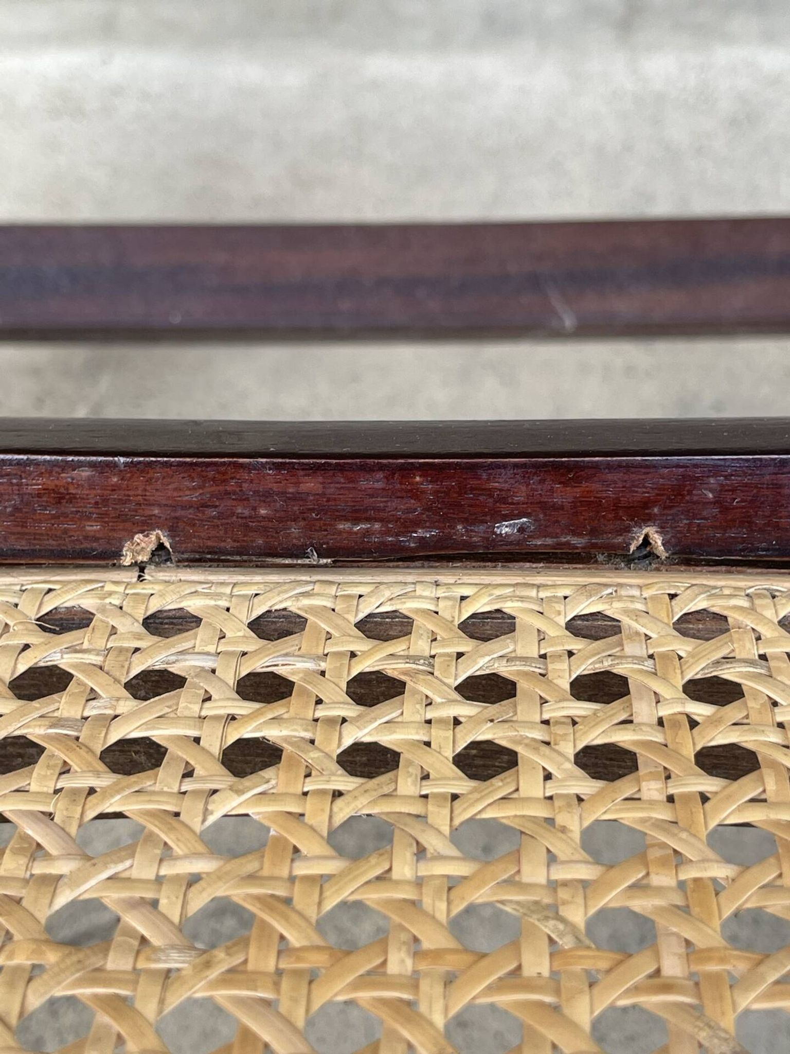 Curved wooden rocking chair with caning