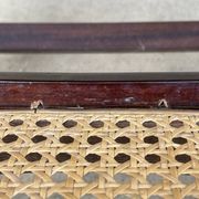 Curved wooden rocking chair with caning