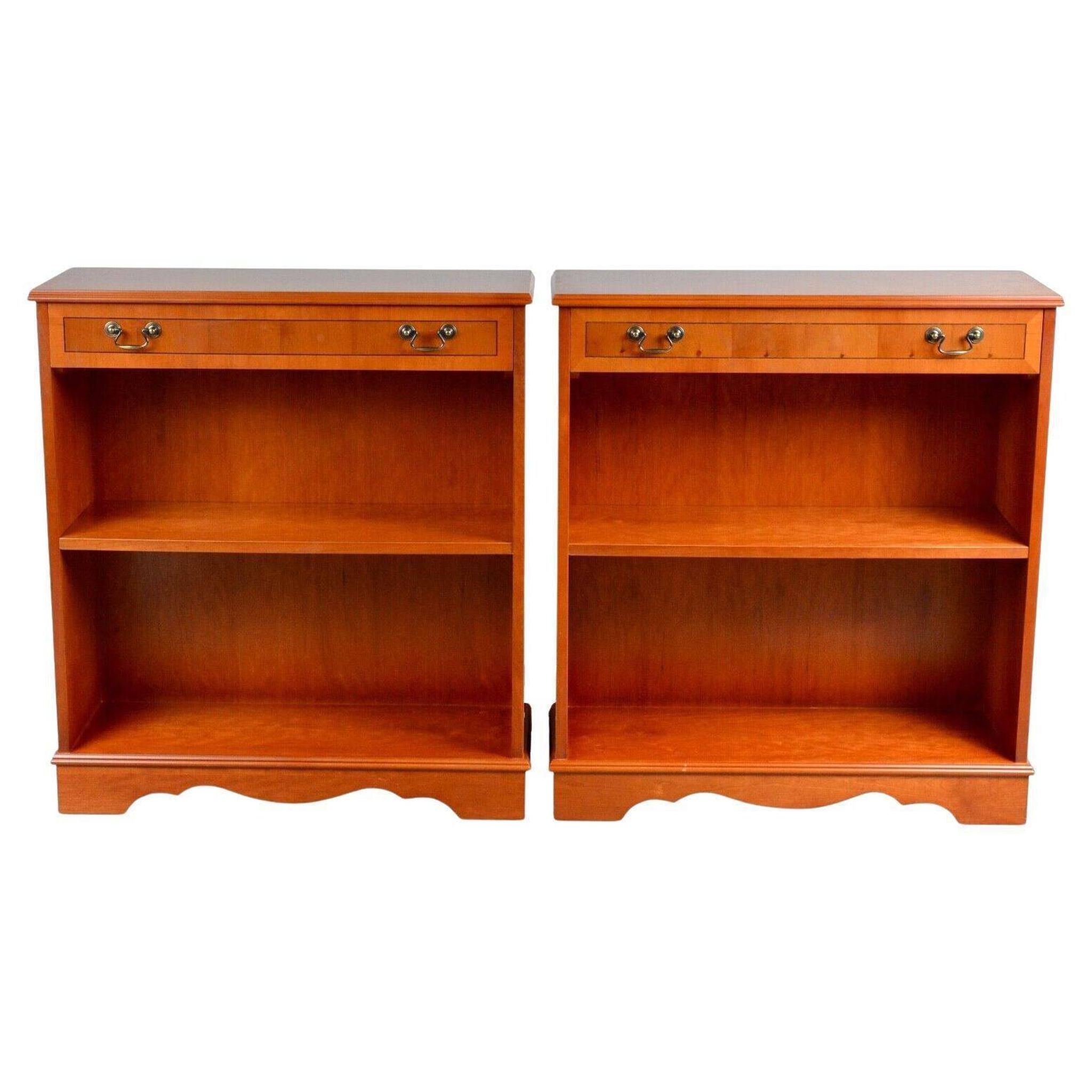 Pair of light walnut bookshelves with inlays and adjustable shelves.
