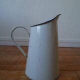 White enamelled metal broc