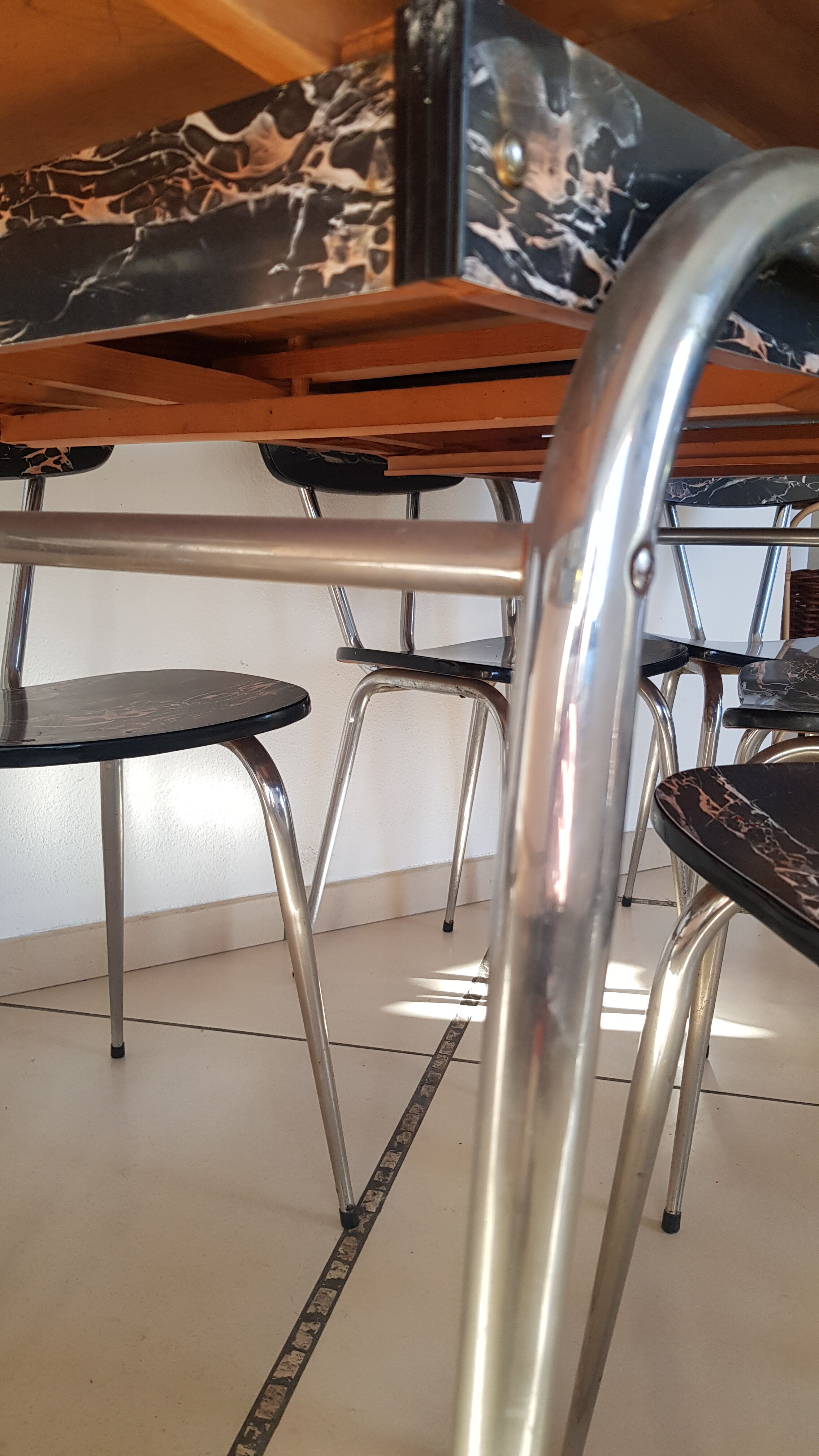 Table and 6 chairs in black formica marble effect