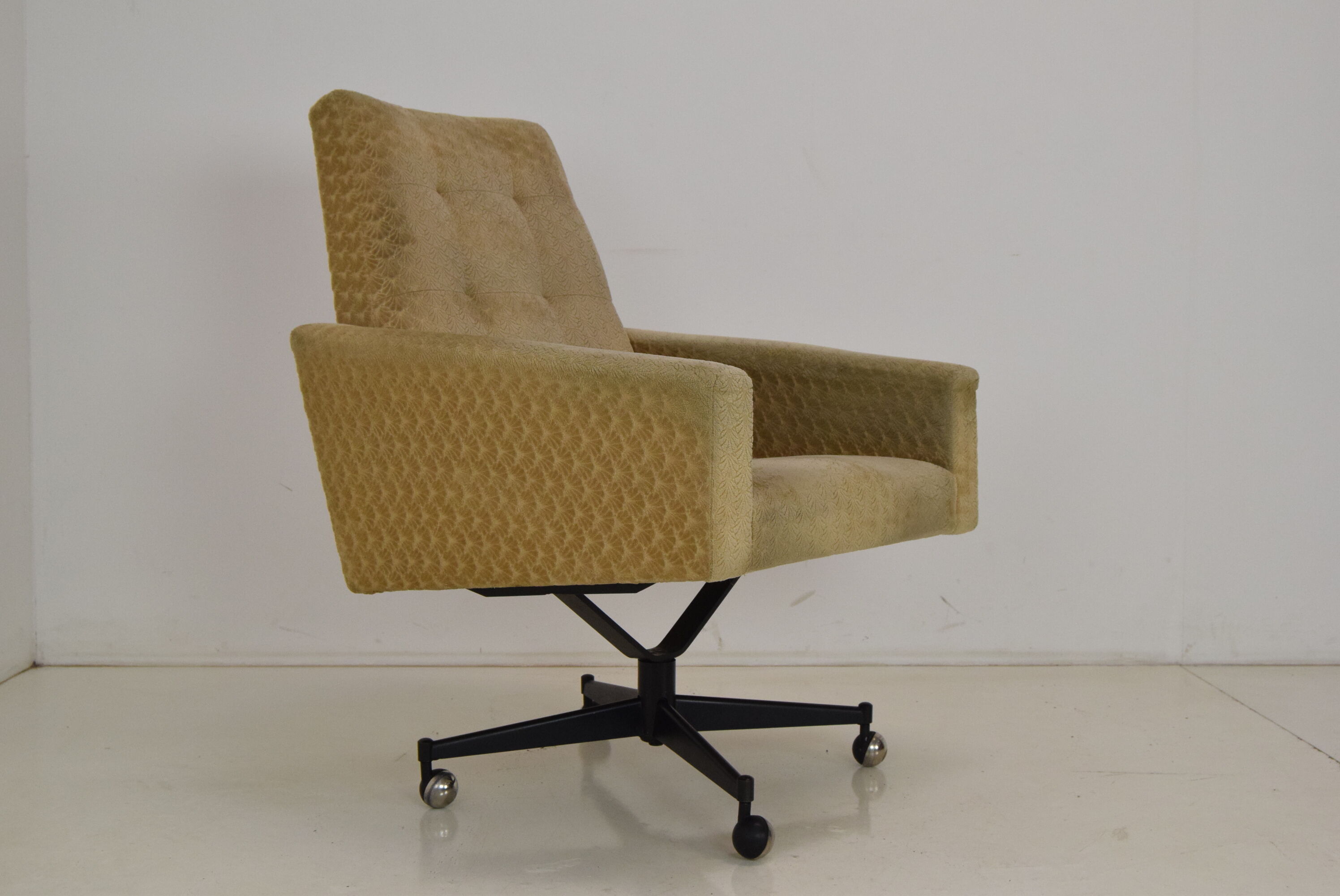 Mid-century swivel armchair with wheels 1970's