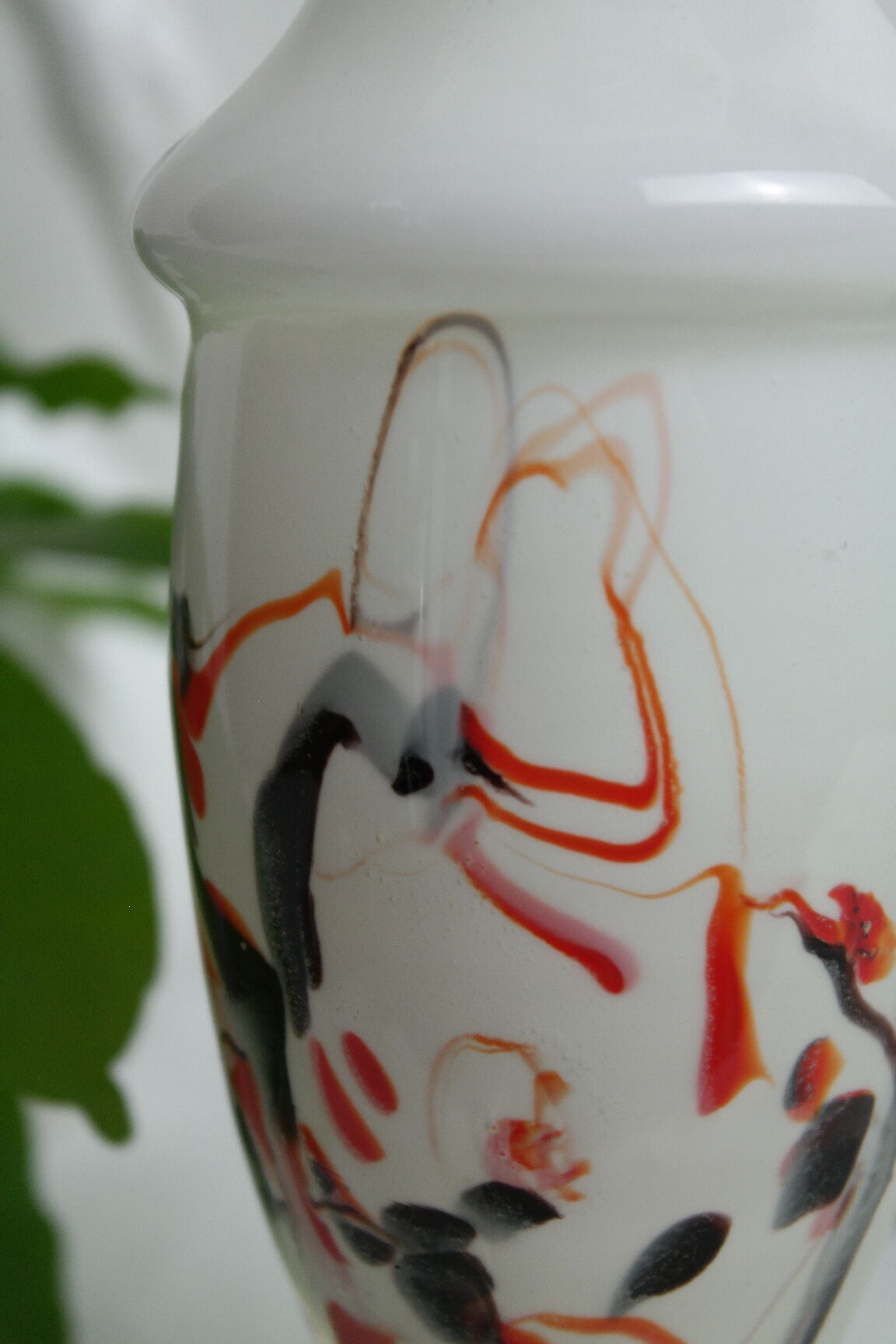 Corolla vase in white opaline with orange-brown patterns.