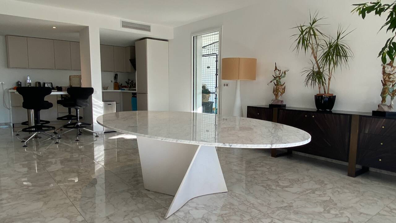 Elliptical table in Carrara marble and Corian attributed to Xavier Lust.