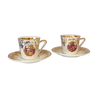 Duo of cups and under cup with coffee or mocha decoration romantic porcelain