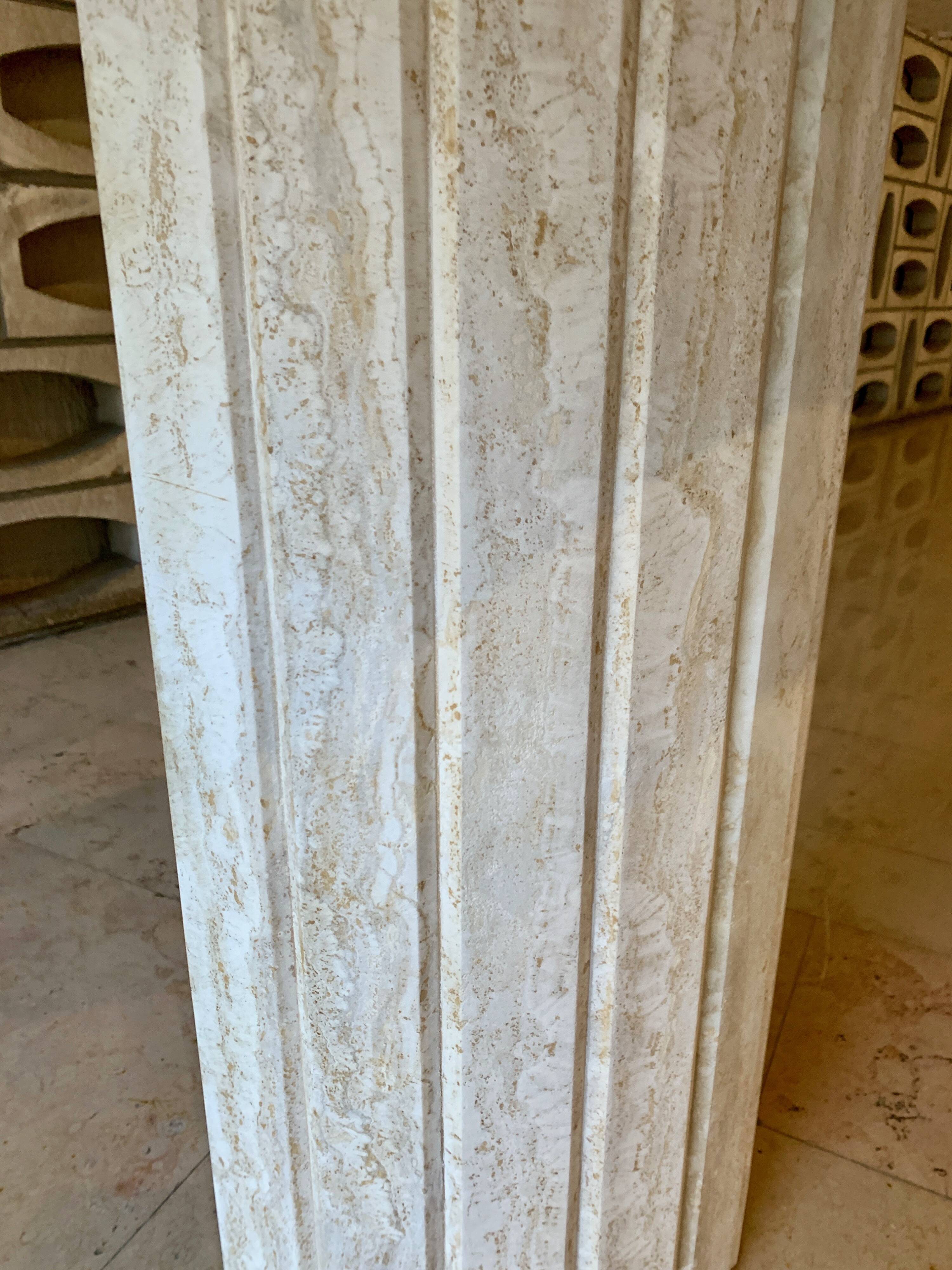Travertine console with canted foot
