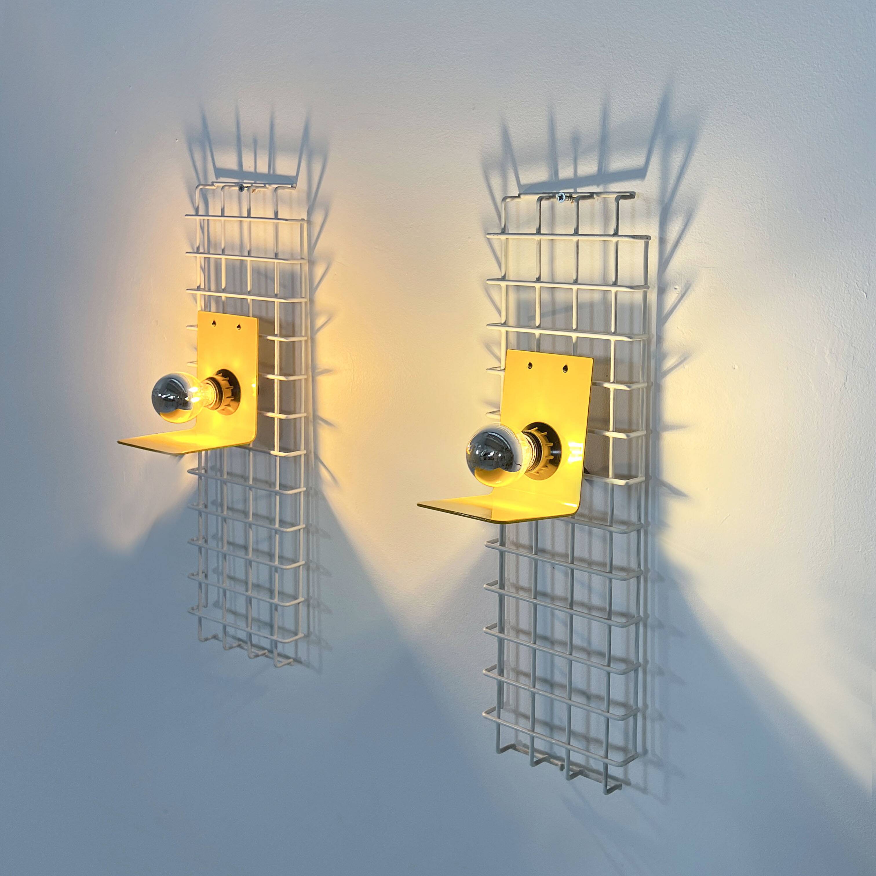 Pair of yellow wall sconces on wire mesh by Seccose, 1980