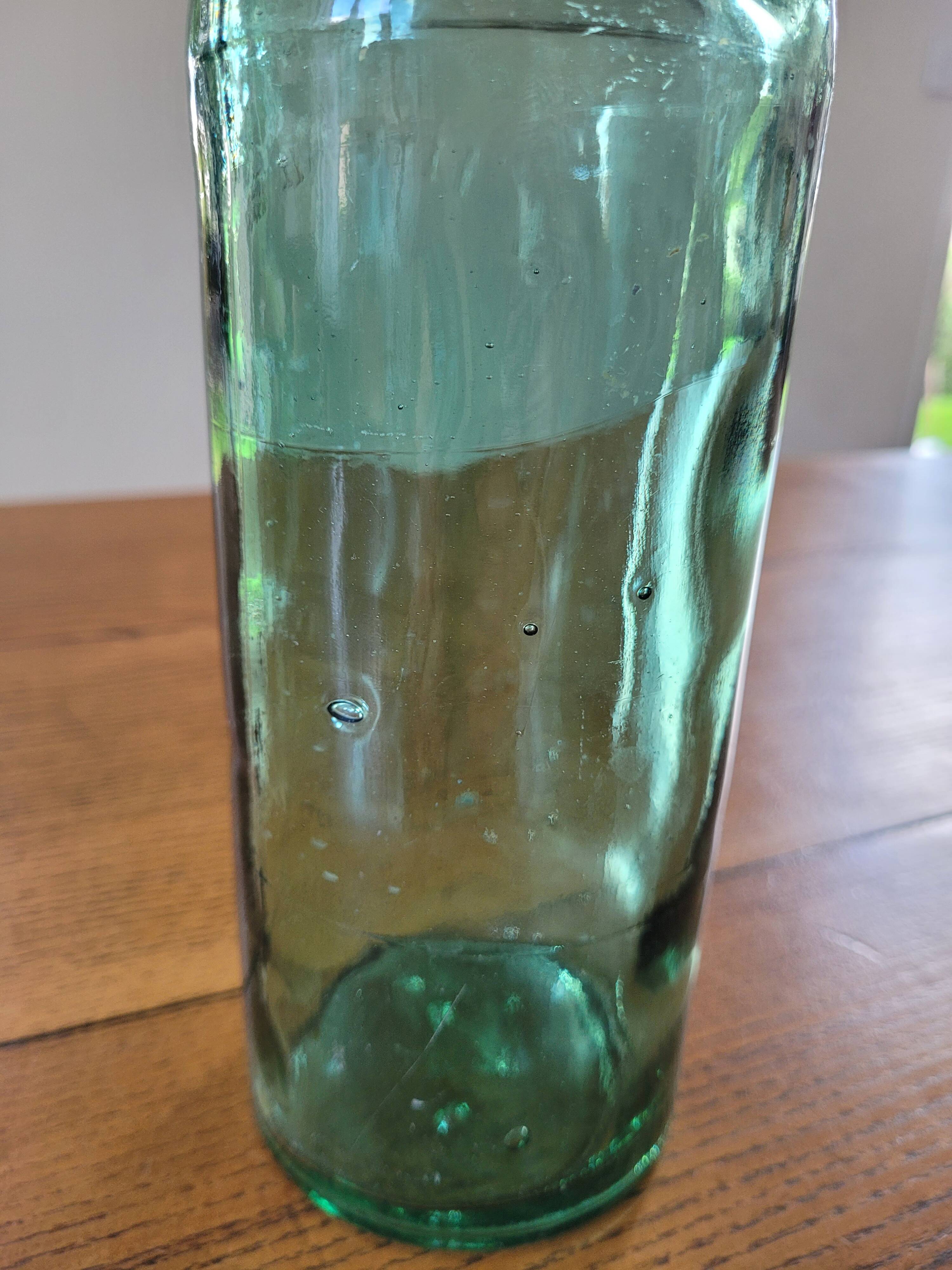Vintage glass bottle l'Idéale with porcelain stopper