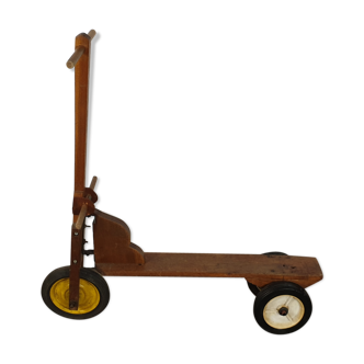 Old three-wheeled wooden scooter