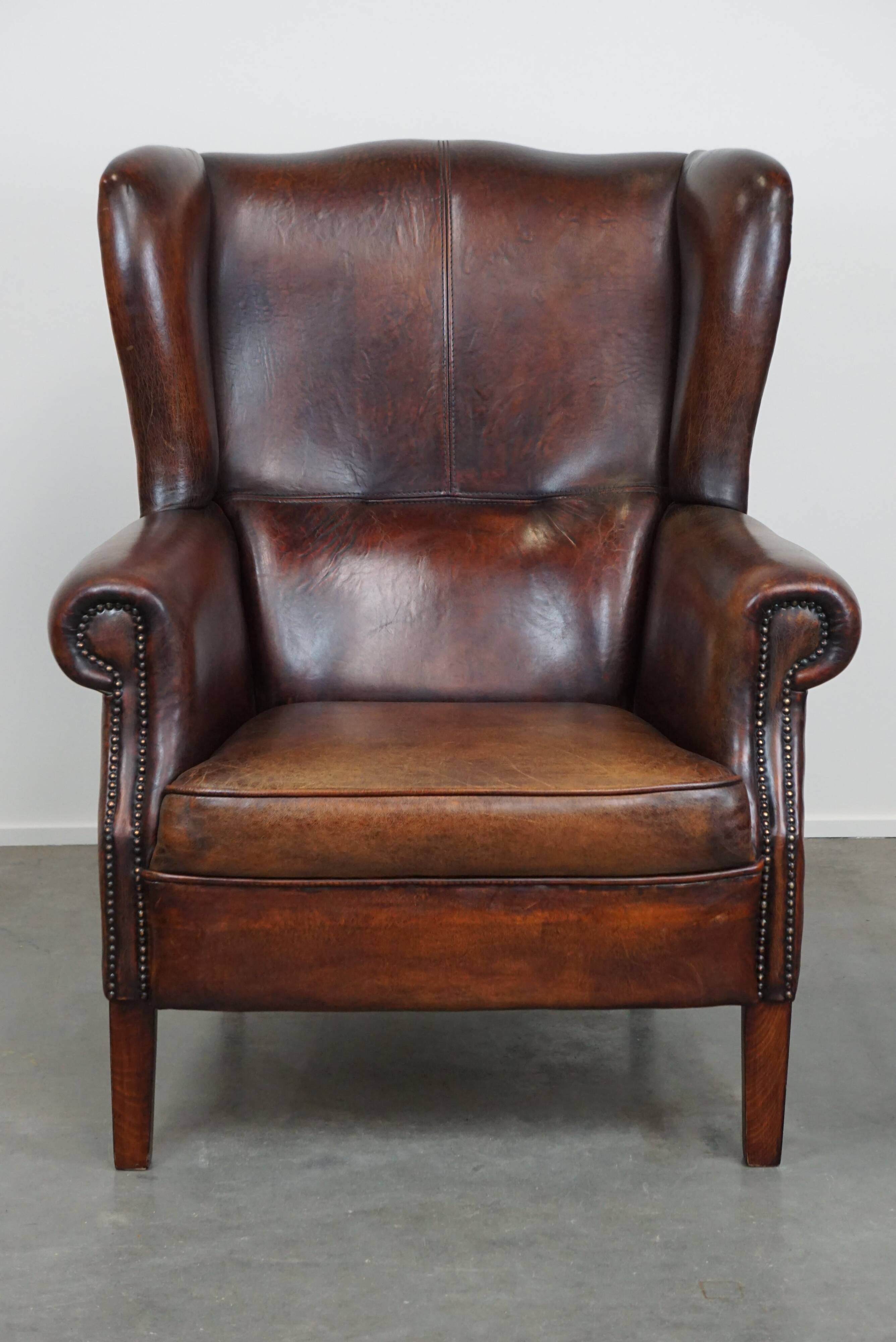 Large Sheepskin Leather Wingback Armchair with a Fixed Seat Cushion and a Stunning Patina