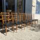 6 chaises bois et skaï noir années 60