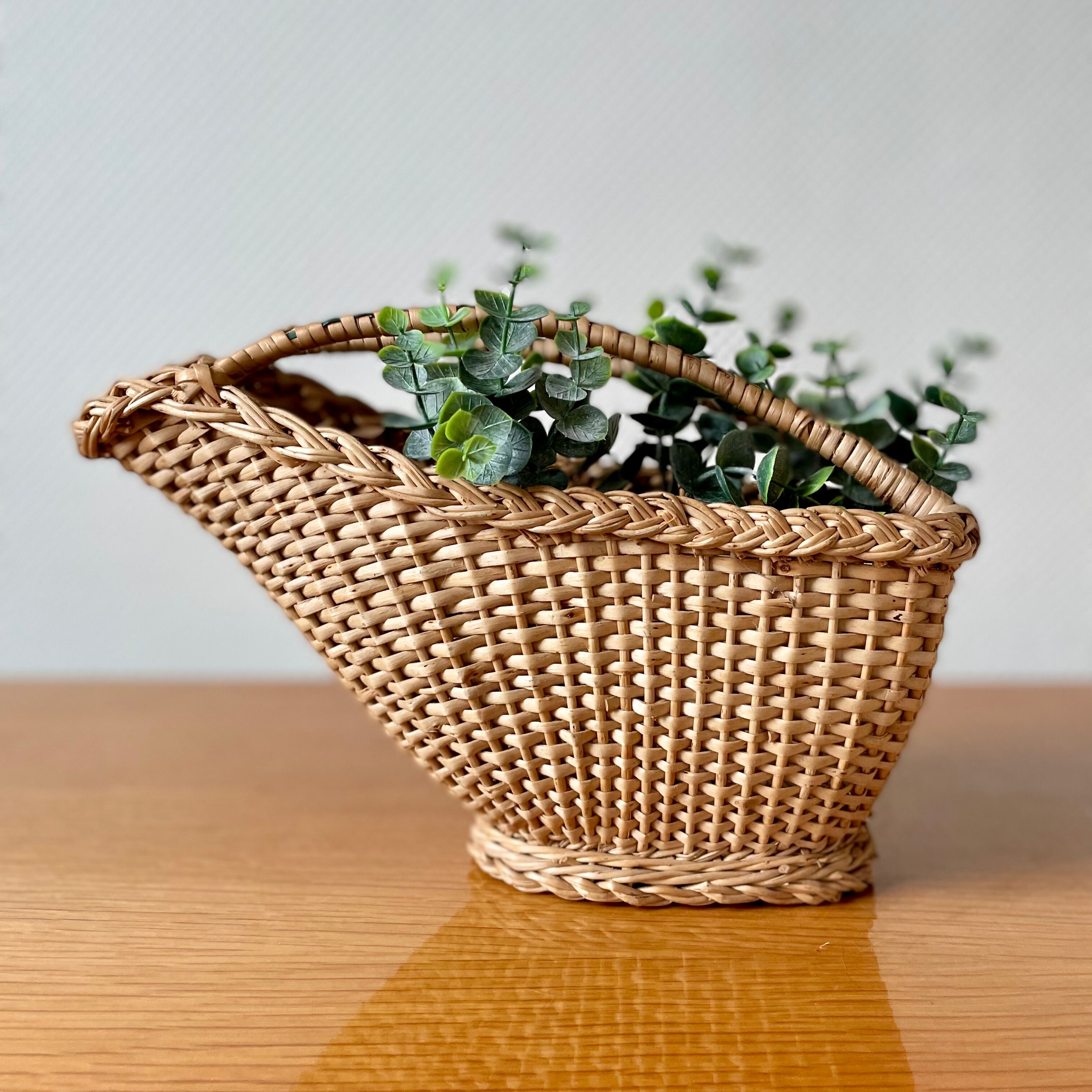 Old rattan pouring basket