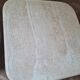 Pair of travertine nesting tables