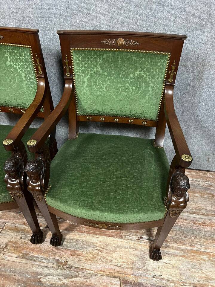 Pair of Empire-Consulate armchairs in molded and carved mahogany