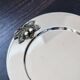 Vintage silver-plated round service tray with embossed cherries.