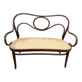 Antique Thonet bench in bent wood and caning, signed.