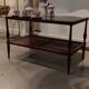 Coffee table / side table in mahogany with a rattan shelf.