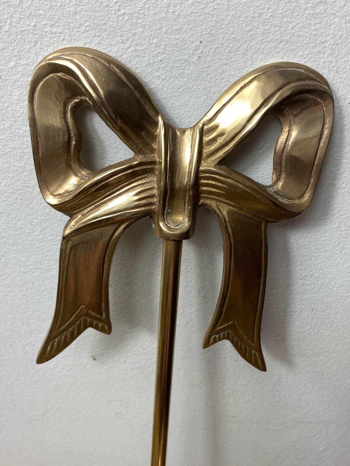 Solid brass bow and ribbon wall candle holder