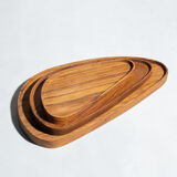 Trio of rounded triangular shaped trays or cups in monoxyl teak