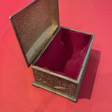 Ancient box made of chiseled metal and stone